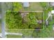 Aerial view of a charming home with mature trees and a well-maintained yard in a quiet neighborhood at 4147 Suzanne Ln, Duluth, GA 30096