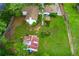 Aerial view of a home with a lush green backyard, mature trees, and a storage shed at 4147 Suzanne Ln, Duluth, GA 30096
