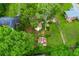 Aerial view of a home with a lush green backyard, mature trees, and a storage shed at 4147 Suzanne Ln, Duluth, GA 30096