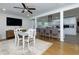 Open concept dining room with view of the kitchen island and appliances at 4147 Suzanne Ln, Duluth, GA 30096