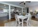Open concept dining room with view of the kitchen island and appliances at 4147 Suzanne Ln, Duluth, GA 30096