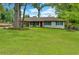 Charming single-story home with a well-maintained lawn, mature trees, and a welcoming front at 4147 Suzanne Ln, Duluth, GA 30096