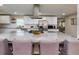 A modern kitchen featuring a large granite island and stainless steel appliances at 4147 Suzanne Ln, Duluth, GA 30096
