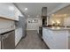 Updated kitchen featuring stainless steel appliances, ample storage, and gray tile flooring at 4147 Suzanne Ln, Duluth, GA 30096