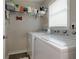 Bright laundry room with shelving and a window for natural light at 4147 Suzanne Ln, Duluth, GA 30096