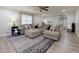 Open-concept living room with a comfortable sectional and stylish rug at 4147 Suzanne Ln, Duluth, GA 30096