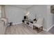 Living room with a modern entertainment center and wood-look flooring at 4147 Suzanne Ln, Duluth, GA 30096