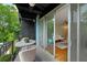 A cozy balcony overlooks a refreshing pool and green surroundings, providing a serene outdoor retreat at 120 Alden Nw Ave # C3, Atlanta, GA 30309