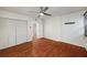 Bedroom with hardwood floors, a ceiling fan, and closet space at 120 Alden Nw Ave # C3, Atlanta, GA 30309