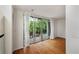 Living room with sliding glass doors open to a terrace with pool views at 120 Alden Nw Ave # C3, Atlanta, GA 30309