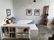 This bedroom features a cozy bed setup, a small bookcase, and a rowing machine for exercise at 170 Boulevard Se # H301, Atlanta, GA 30312