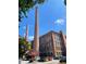 Exterior view of brick building with smokestacks against a blue sky at 170 Boulevard Se # H301, Atlanta, GA 30312