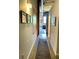A well-lit hallway featuring vintage structural support, neutral color palette, and access to various areas of the house at 170 Boulevard Se # H301, Atlanta, GA 30312