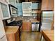 Compact kitchen with stainless steel appliances and tiled backsplash, adding charm at 170 Boulevard Se # H301, Atlanta, GA 30312