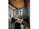 Inviting living room featuring exposed brick walls, wood ceilings, and abundant natural light from large windows at 170 Boulevard Se # H301, Atlanta, GA 30312