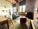 Inviting open living space features exposed brick, large windows, and modern furnishings at 170 Boulevard Se # H301, Atlanta, GA 30312