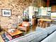 Open concept living area with exposed brick, modern kitchen, and comfortable seating at 170 Boulevard Se # H301, Atlanta, GA 30312
