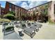 Exterior lounge area with lots of seating and shade beside a historic brick building at 170 Boulevard Se # H301, Atlanta, GA 30312