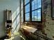Bright office nook featuring exposed brick, large window, and comfortable workspace at 170 Boulevard Se # H301, Atlanta, GA 30312