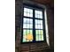 A window with a view and plenty of natural light, set in a brick wall with an arched top at 170 Boulevard Se # H301, Atlanta, GA 30312