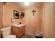 Charming bathroom featuring wood paneled walls, toilet, sink, and decor at 200 Rogers Rd, Kingston, GA 30145