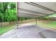 Large covered carport provides protected space for vehicle storage or work area at 200 Rogers Rd, Kingston, GA 30145