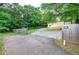 Commercial building with carport surrounded by fenced perimeter ensures safety and privacy at 200 Rogers Rd, Kingston, GA 30145
