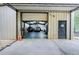 Wide angle view of a garage with two trucks and metal walls and ceiling at 200 Rogers Rd, Kingston, GA 30145
