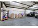 Shot of a very large garage with metal frame and ceiling, containing work trucks at 200 Rogers Rd, Kingston, GA 30145