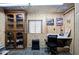 Functional office space with wooden walls, shelving, desk, and chair at 200 Rogers Rd, Kingston, GA 30145