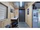 A work space and office with wood walls and a desk and chair at 200 Rogers Rd, Kingston, GA 30145