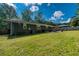 Spacious backyard featuring a patio, shed, and plenty of room for outdoor activities at 2462 Pate S St, Snellville, GA 30078