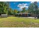 Expansive backyard offering ample green space, a patio, and a storage shed at 2462 Pate S St, Snellville, GA 30078