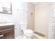 Bathroom featuring a vanity, toilet, tiled walk in shower and overhead fan at 2462 Pate S St, Snellville, GA 30078