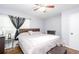 Bedroom featuring hardwood floors and a comfortable bed with a wood headboard at 2462 Pate S St, Snellville, GA 30078