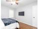 Bedroom showcasing hardwood floors and a wall-mounted television for entertainment at 2462 Pate S St, Snellville, GA 30078