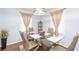 Inviting dining area featuring a modern glass table, stylish decor, and ample natural light at 2462 Pate S St, Snellville, GA 30078