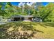 Charming single-story home with a well-manicured lawn and mature trees providing shade at 2462 Pate S St, Snellville, GA 30078