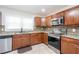Well-equipped kitchen with stainless steel appliances, granite countertops, and ample cabinet space at 2462 Pate S St, Snellville, GA 30078
