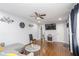 Cozy living room featuring hardwood floors, modern decor, and a ceiling fan at 2462 Pate S St, Snellville, GA 30078