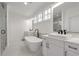 Spacious bathroom with soaking tub, glass shower, double sinks, and natural light at 4505 Caroline Walk, Dunwoody, GA 30338