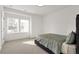 Bright bedroom with neutral walls, carpet floors, and a large window with natural light at 4505 Caroline Walk, Dunwoody, GA 30338