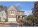 Charming brick two-story home with manicured landscaping, attached garage, and inviting curb appeal at 4505 Caroline Walk, Dunwoody, GA 30338