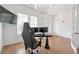 Modern home office with hardwood floors, ample natural light, and a view of the front yard at 4505 Caroline Walk, Dunwoody, GA 30338