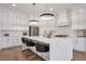 Open-concept kitchen features a large island, modern appliances, and sleek cabinetry at 4505 Caroline Walk, Dunwoody, GA 30338