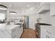 Elegant kitchen boasts custom cabinets, stainless steel appliances, and stone countertops at 4505 Caroline Walk, Dunwoody, GA 30338