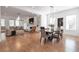 Open floor plan living and dining rooms with fireplace, built-ins, and hardwood floors at 4505 Caroline Walk, Dunwoody, GA 30338