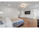 Spacious main bedroom with hardwood floors, large TV and walk out to hall at 4505 Caroline Walk, Dunwoody, GA 30338