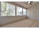 Screened porch with wood floors and views of the backyard trees at 4505 Caroline Walk, Dunwoody, GA 30338