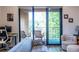 Balcony with outdoor seating adjacent to living room with great views at 112 Rogers St # 208, Atlanta, GA 30317